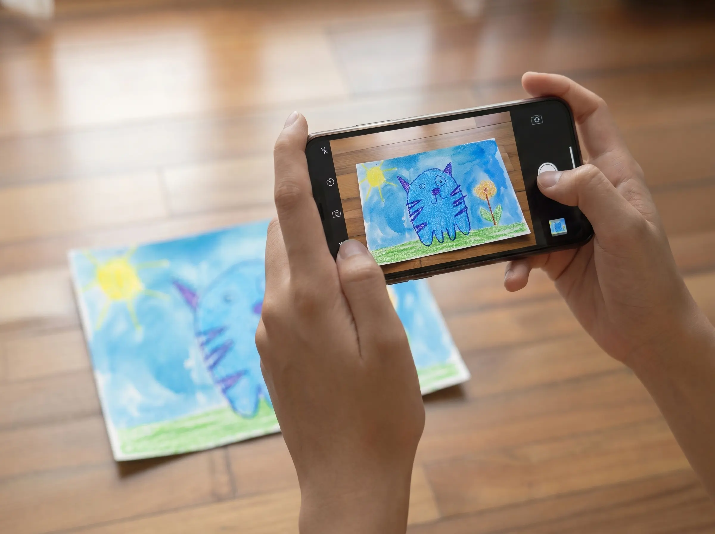 A phone camera is all it takes to photograph kids' artwork at home.