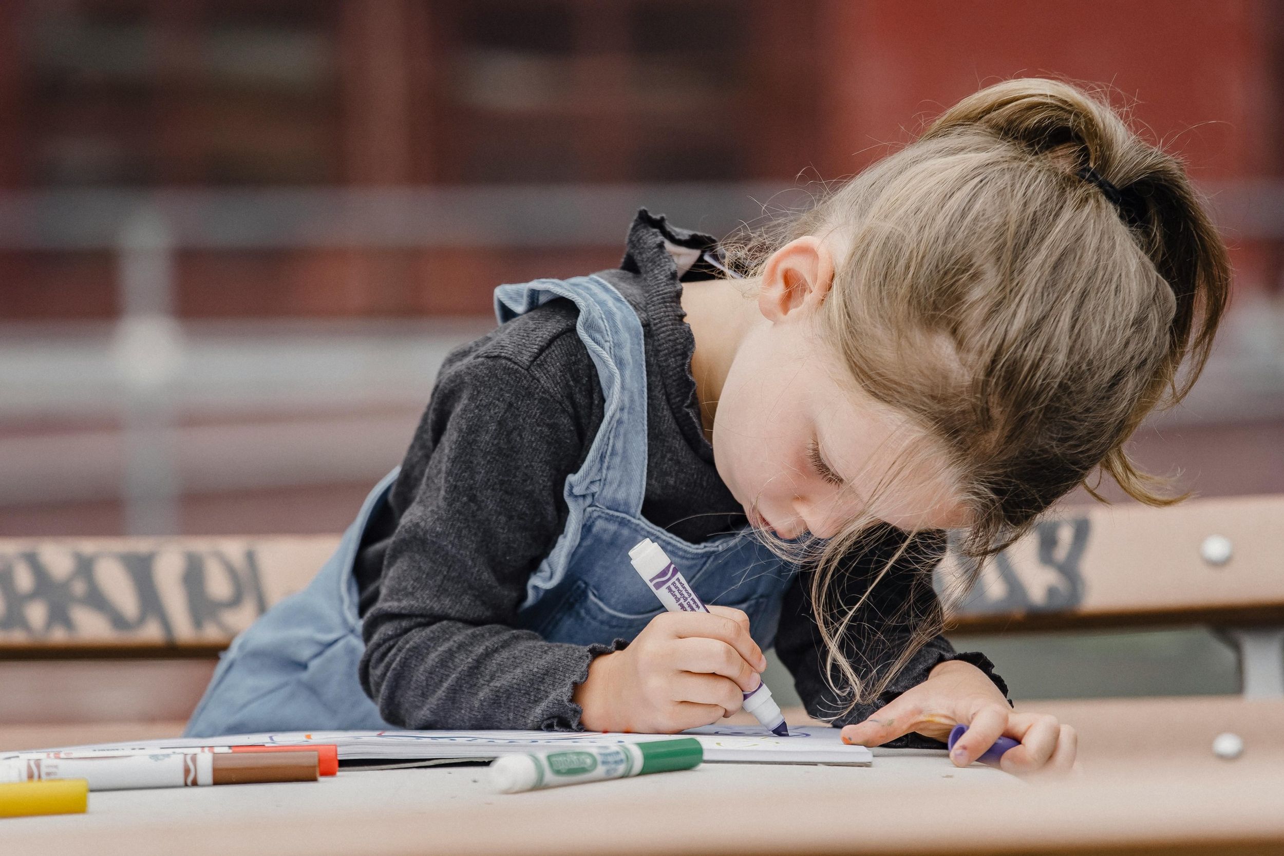 A child coloring for National Scribble Day
